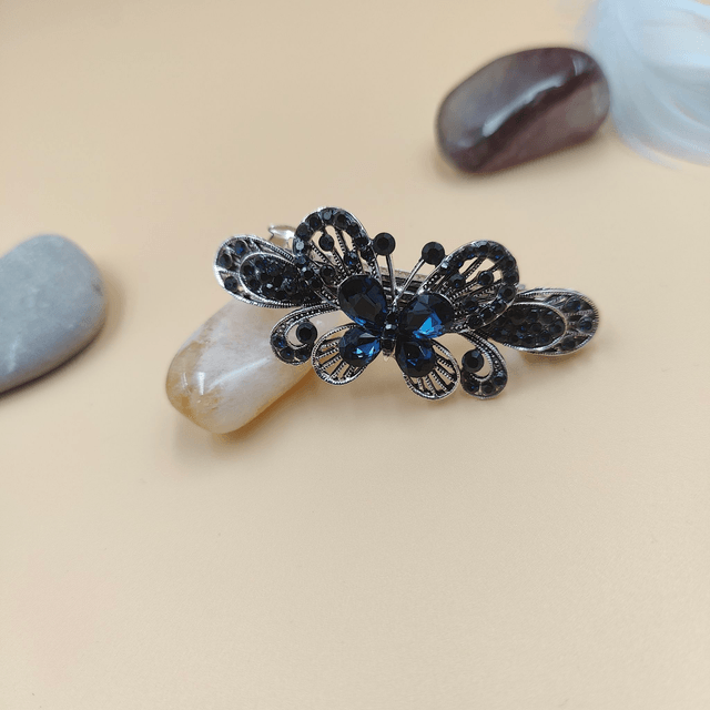 Barrette noire en forme de papillon avec strass bleus - Accessoire élégant et raffiné pour cheveux