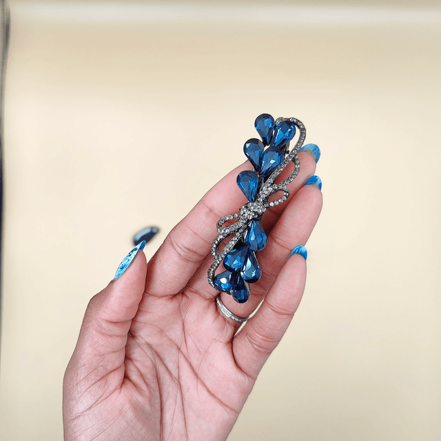Barrette noire en forme de nœud avec strass bleus - Accessoire élégant et raffiné pour cheveux